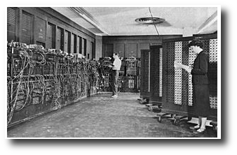 A man and women working with the first ever electronic computer.