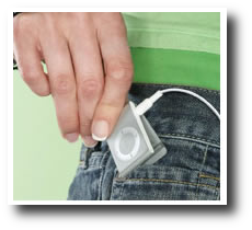 The iPod being placed into someones pocket.